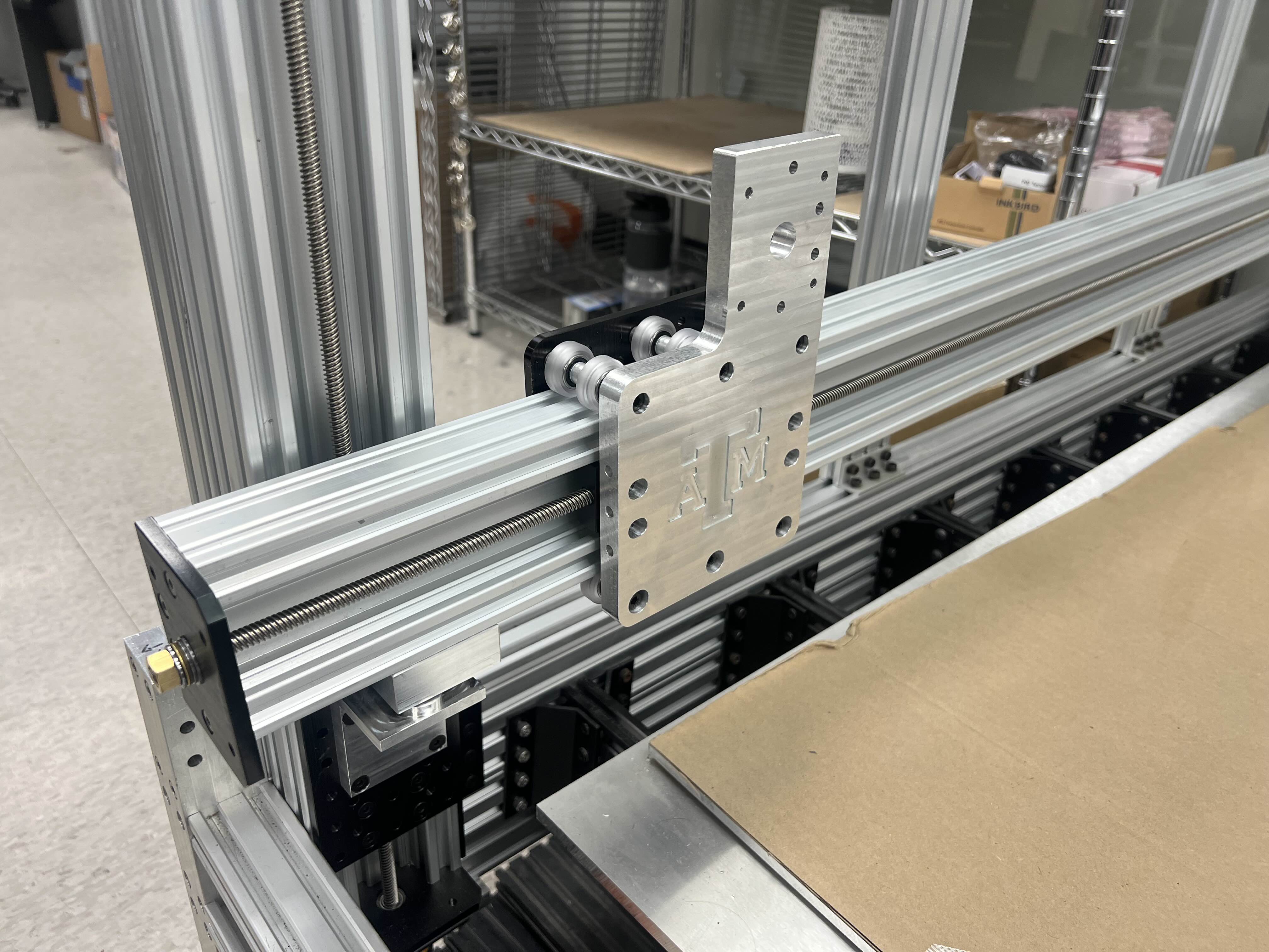 Y-axis plate with TAMU logo